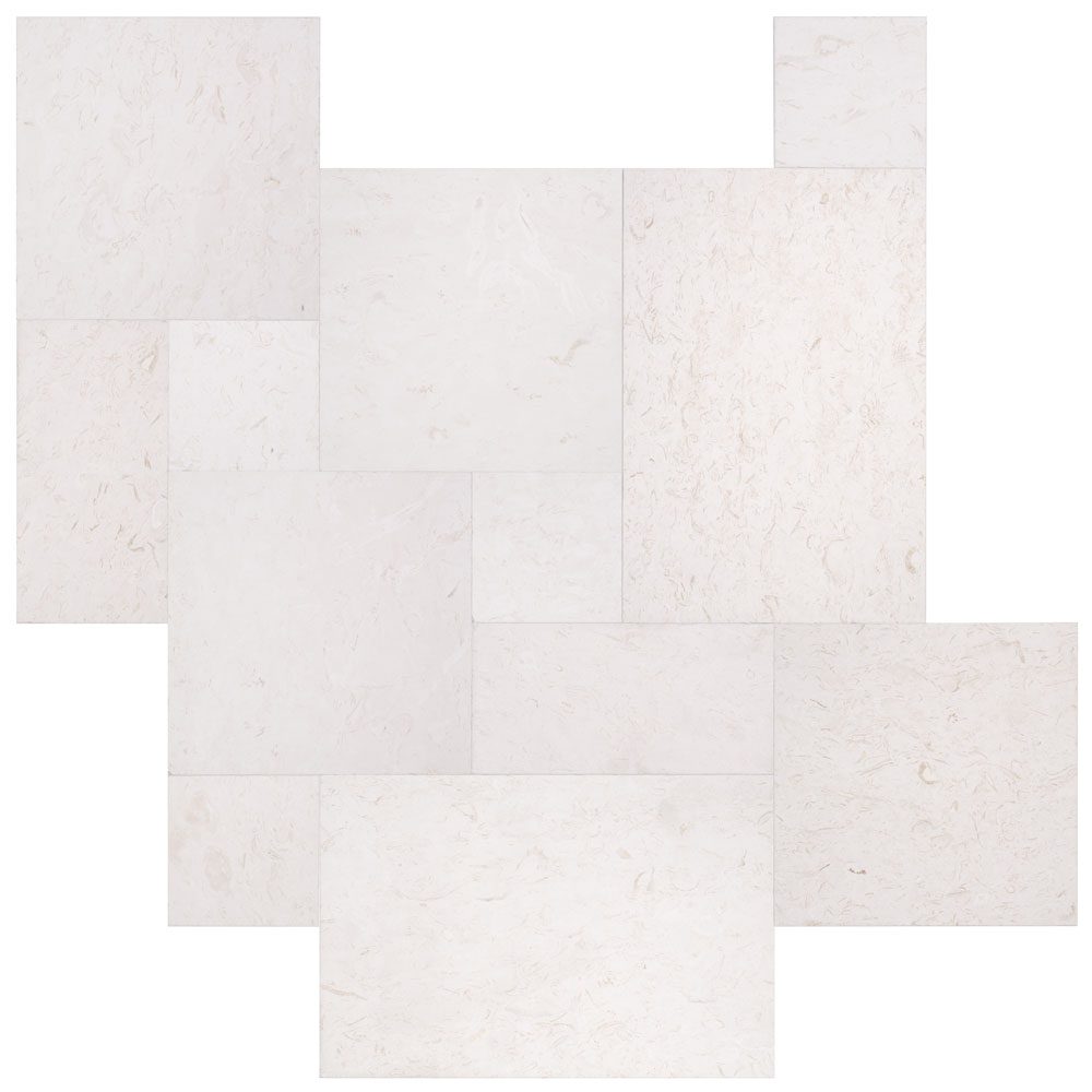 Mixed-size white marble tiles arranged in a scattered pattern.