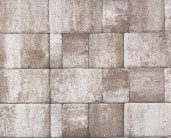 Image of a textured wall with a pattern of rectangular stone blocks in various shades of grey and brown.